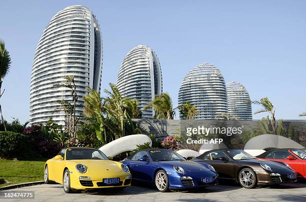 China-economy-property-Hainan,FEATURE by Tom Hancock This picture taken on January 19, 2013 shows several sports cars parked in front of luxury...