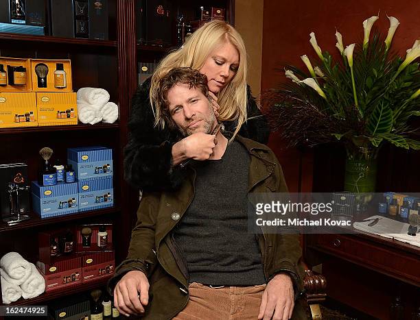 Actor Thomas Jane and actress Peta Wilson pose for a photo at the The Art of Shaving And Bungalow 8 Pre-Oscar Party at Petit Ermitage Hotel on...