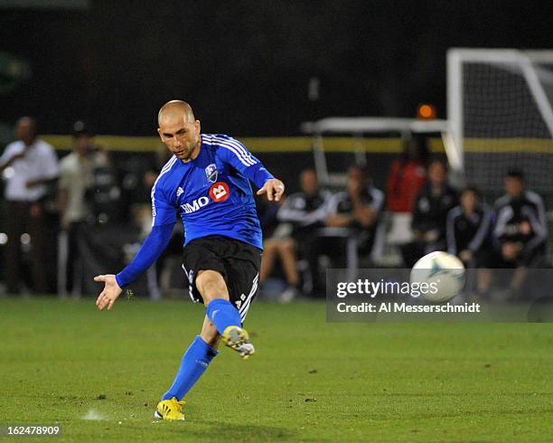 Forward Marco Di Vaio of the Montreal Impact attempts a penalty kick against the Columbus Crew in the final round of the Disney Pro Soccer Classic on...