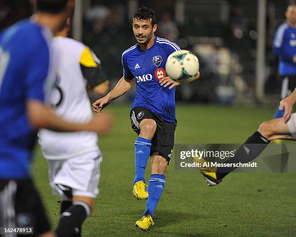 Midfielder Felipe Martins of the Montreal Impact passes upfield against the Columbus Crew in the final round of the Disney Pro Soccer Classic on...