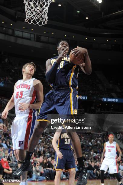 Ian Mahinmi of the Indiana Pacers grabs a rebound against Viacheslav Kravtsov of the Detroit Pistons on February 23, 2013 at The Palace of Auburn...