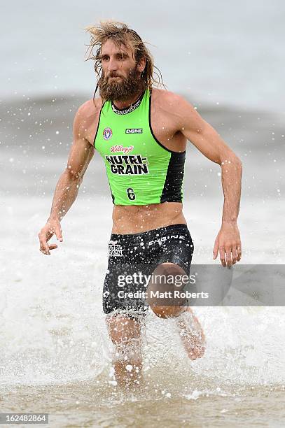 Corey Jones runs out of the water during the Noosa Heads round of the 2012-13 Kelloggs Nutri-Grain Ironman Series on February 24, 2013 in Noosa,...