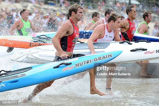 Hugh Dougherty runs into the water for the board portion during the Noosa Heads round of the 2012-13 Kelloggs Nutri-Grain Ironman Series on February...