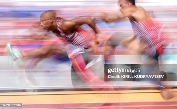 Canada's Damian Warner and Canada's Pierce Lepage compete in the men's decathlon 110m hurdles heat 3 during the World Athletics Championships at the...