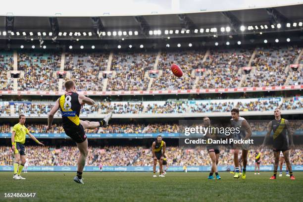 Jack Riewoldt of the Tigers kicks for goal during the round 23 AFL match between Richmond Tigers and North Melbourne Kangaroos at Melbourne Cricket...