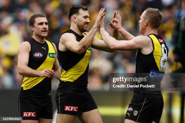 Noah Balta of the Tigers celebrates with Jack Riewoldt of the Tigers after kicking a goal during the round 23 AFL match between Richmond Tigers and...