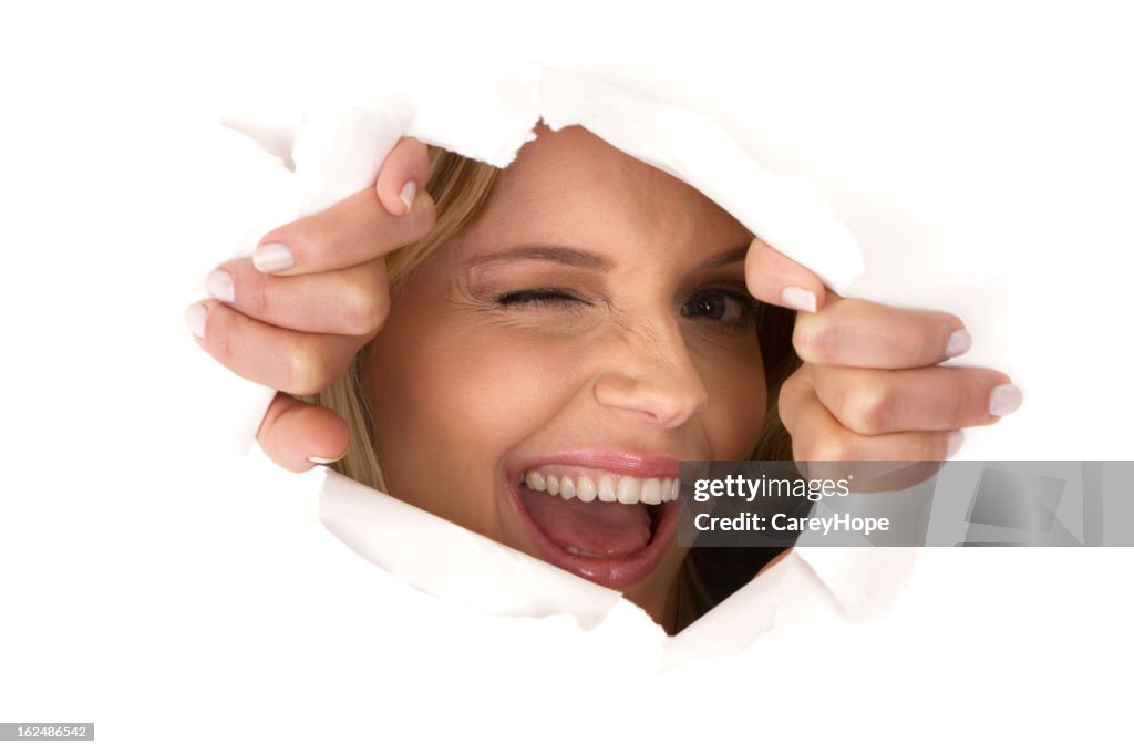 Exploding Through Paper Woman Breaking Through Paper High-Res Stock Photo - Getty Images