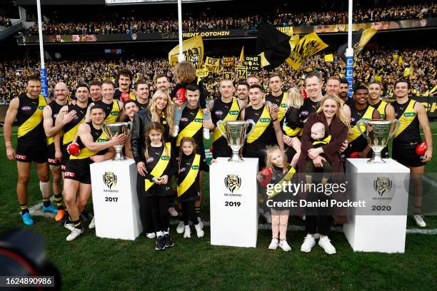 Trent Cotchin of the Tigers and Jack Riewoldt of the Tigers pose for a photograph with their families and teammates and the 2017 2020 Premiership...