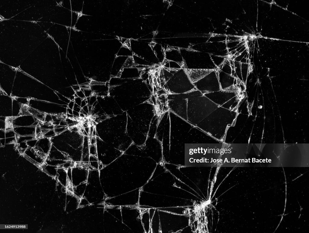 Screen of a mobile phone with broken glass.