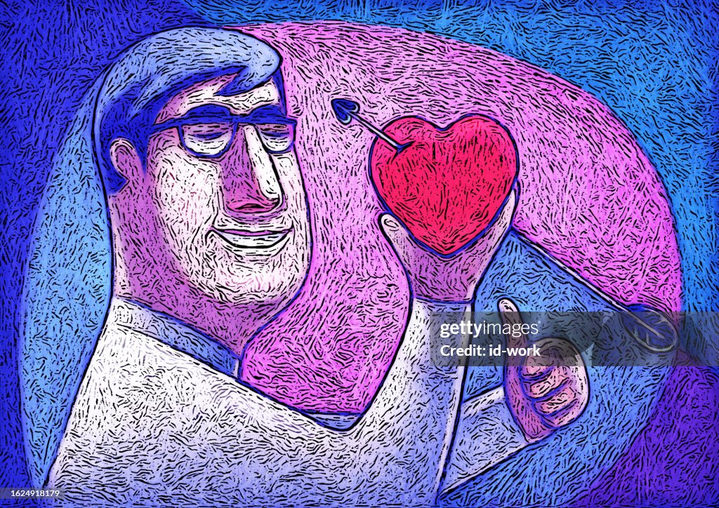 Cheerful man holding heart with arrow and gesturing thumbs up