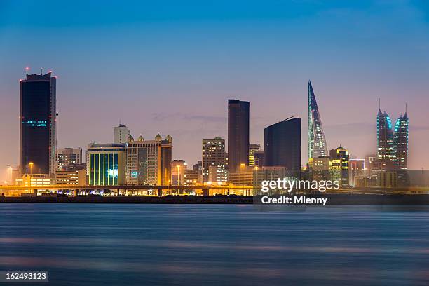 bahrain manama by night - bahrain finance stock pictures, royalty-free photos & images