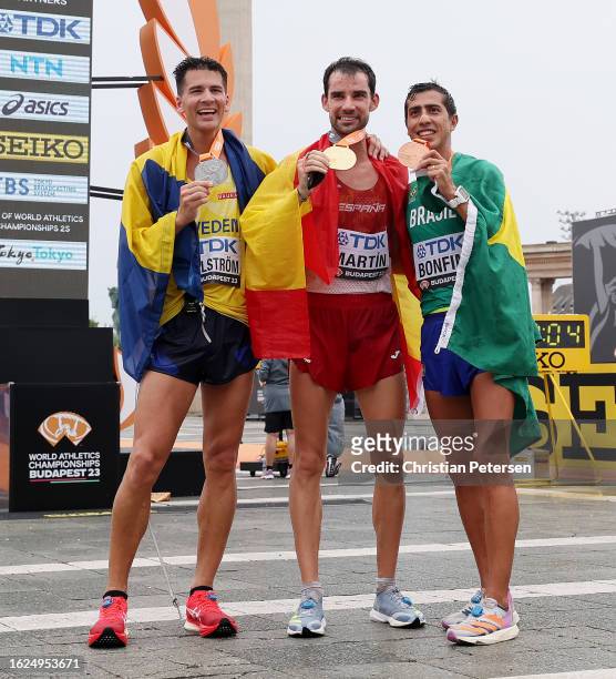 Silver medalist Perseus Karlstroem of Team Sweden, gold medalist Alvaro Martin of Team Spain and bronze medalist Caio Bonfim of Team Brazil pose for...