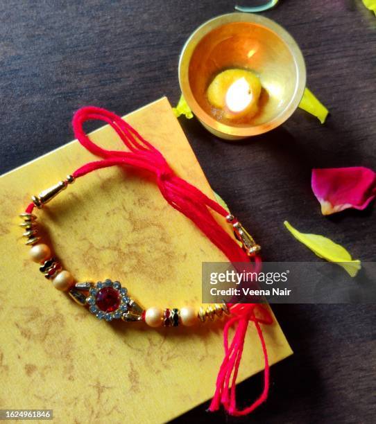 lit oil brass lamp/rakhi thread/happy rakshabandhan/rakhi/indian festival - rakhi ストックフォトと画像