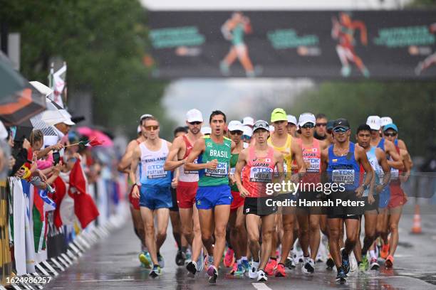 Caio Bonfim of Team Brazil, Koki Ikeda of Team Japan and Brian Daniel Pintado of Team Ecuador compete in Men's 20km Race Walk Final during day one of...