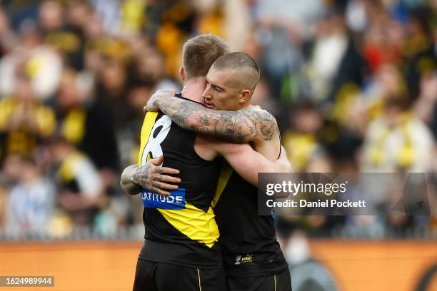 Dustin Martin of the Tigers and Jack Riewoldt of the Tigers hug on the final siren after winning the round 23 AFL match between Richmond Tigers and...