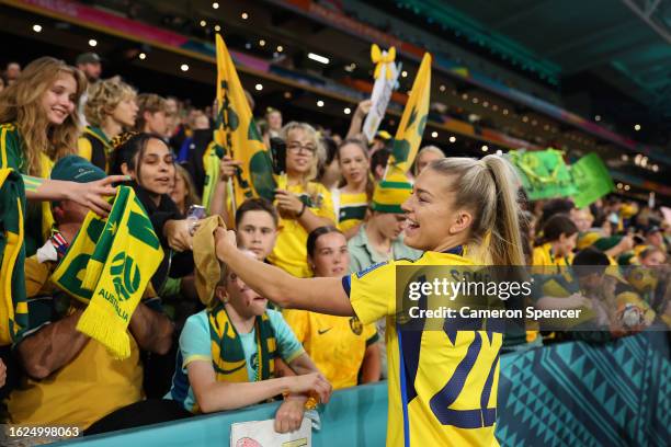 Charlotte Grant of Australia signs autographs for fans after the FIFA Women's World Cup Australia & New Zealand 2023 Third Place Match match between...