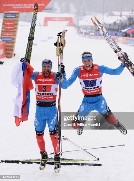 Alexey Petukhov and Nikita Kriukov of Russia celebrate victory in the Men's Team Sprint Final at the FIS Nordic World Ski Championships on February...