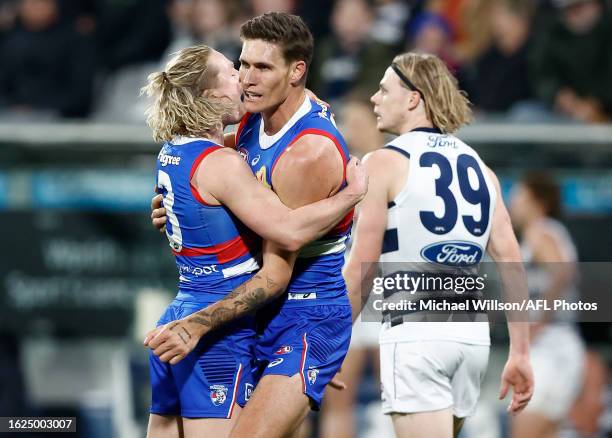 Cody Weightman and Rory Lobb of the Bulldogs celebrate during the 2023 AFL Round 24 match between the Geelong Cats and the Western Bulldogs at GMHBA...