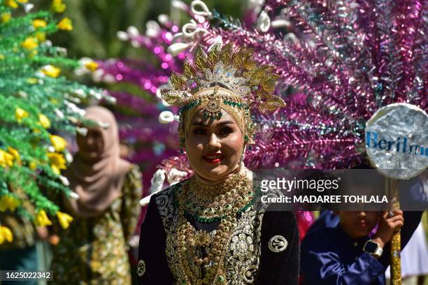 Participants take part in a parade welcoming the Islamic New Year and celebrating the culture and traditions of Thailand's southern province of...