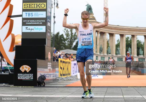 Veli-Matti Partanen of Team Finland celebrates as he crosses the finish line in Men's 20km Race Walk Final during day one of the World Athletics...