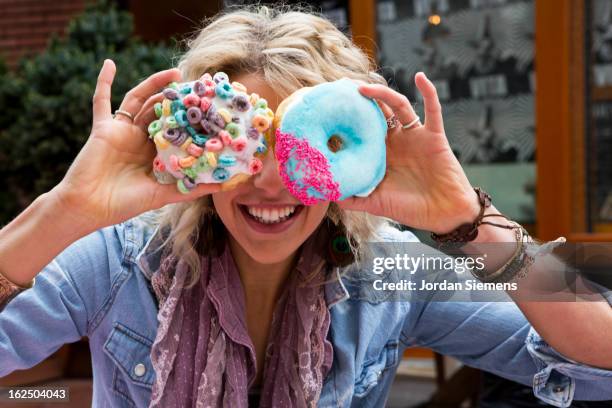 fun with doughnuts. - portland oregon bildbanksfoton och bilder