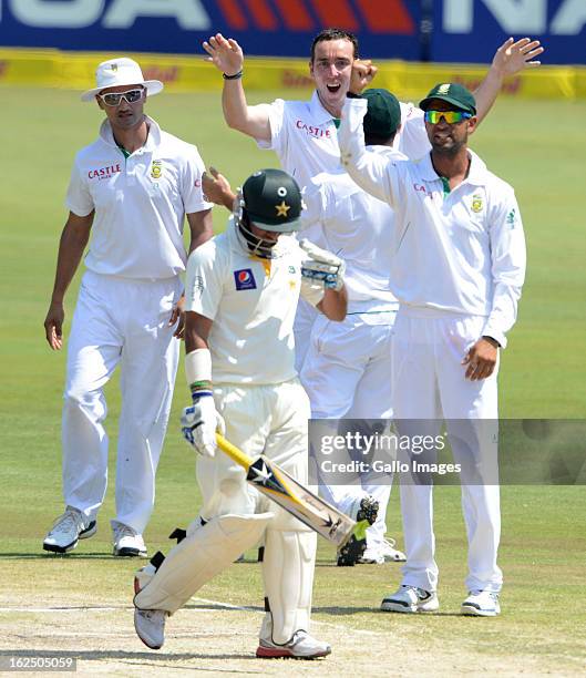 Kyle Abbott of South Africa celebrates the wicket of Imran Farhat of Pakistan during day 3 of the 3rd Test match between South Africa and Pakistan at...