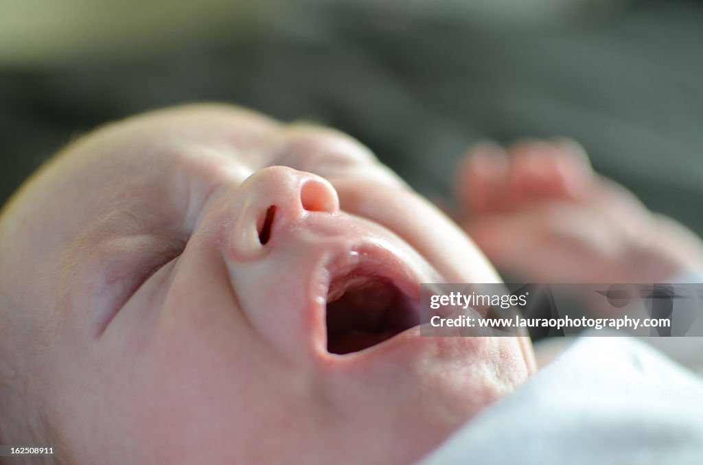 2 week old baby yawning