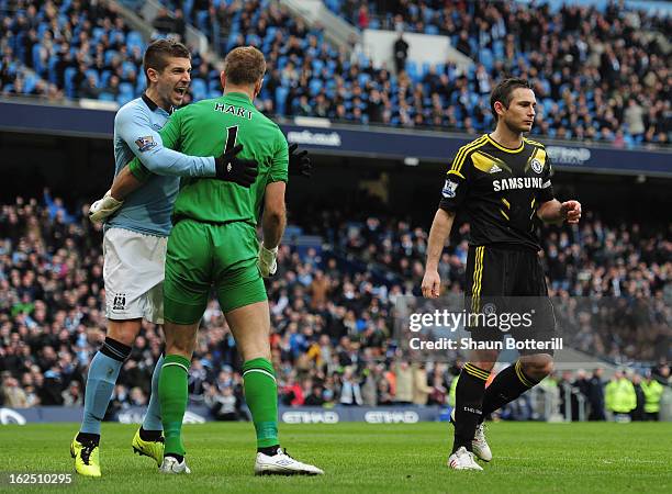 Joe Hart of Manchester City celebrates with Matija Nastasic after saving a penalty from Frank Lampard of Chelsea penalty during the Barclays Premier...