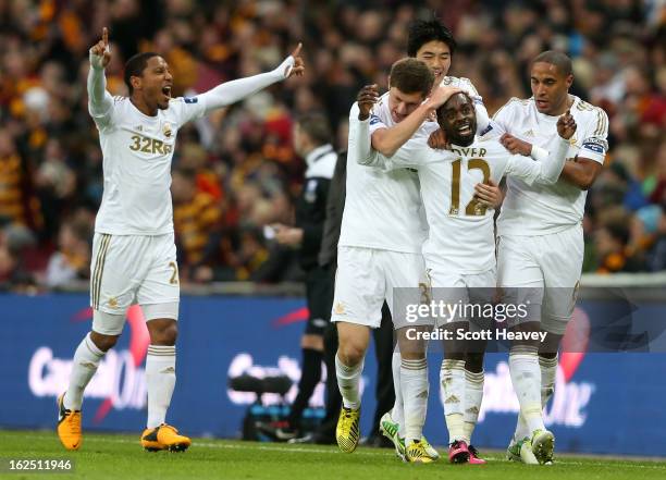 Nathan Dyer of Swansea City celebrates with team mates after scoring the opening goal during the Capital One Cup Final match between Bradford City...