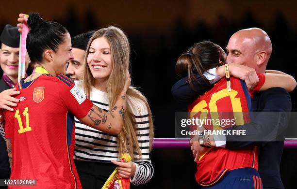 Spain's defender Rocio Galvez is congratuled by President of the Royal Spanish Football Federation Luis Rubiales next to Spain's Jennifer Hermoso...