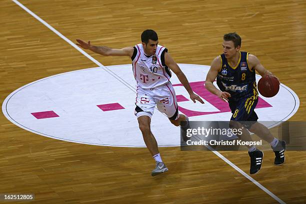Jared Jordan of Telekom Baskets Bonn defends against Heiko Schaffartzik of Alba Berlin during the Beko BBL Basketball Bundesliga match between...