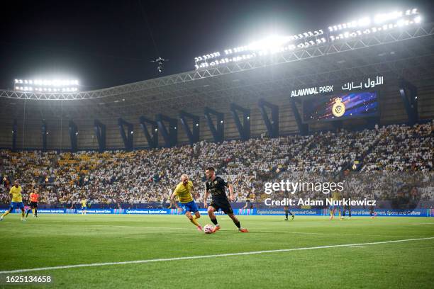 Alvaro Medran Just from Al Taawon FC fights for the ball with Marcelo Brozovic from Al Nassr FC during the Saudi Pro League football match between...