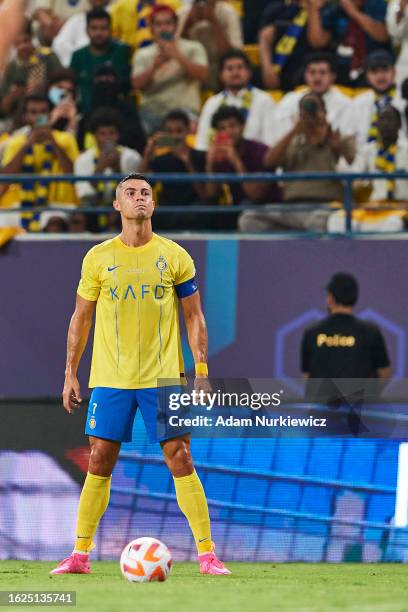 Cristiano Ronaldo dos Santos Aveiro from Al Nassr FC prepares free kick during the Saudi Pro League football match between Al-Nassr and Al-Taawon at...