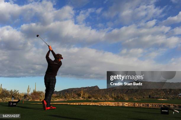 Ian Poulter of England hits a shot on the fourth hole during the semi-final round of the World Golf Championships-Accenture Match Play Championship...