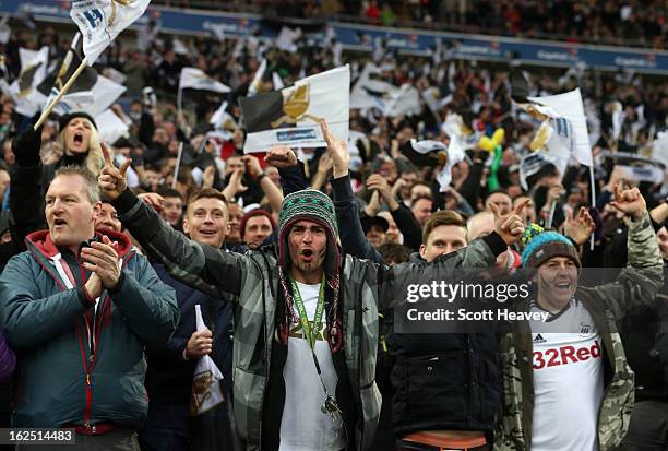 Swansea fans celebrate after Nathan Dyer of Swansea City socres their third goal during the Capital One Cup Final match between Bradford City and...