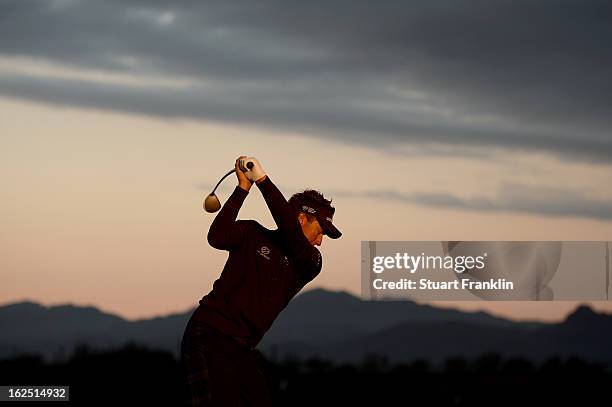 Ian Poulter of England hits practice balls on the range prior to his semifinal round match of the World Golf Championships - Accenture Match Play at...