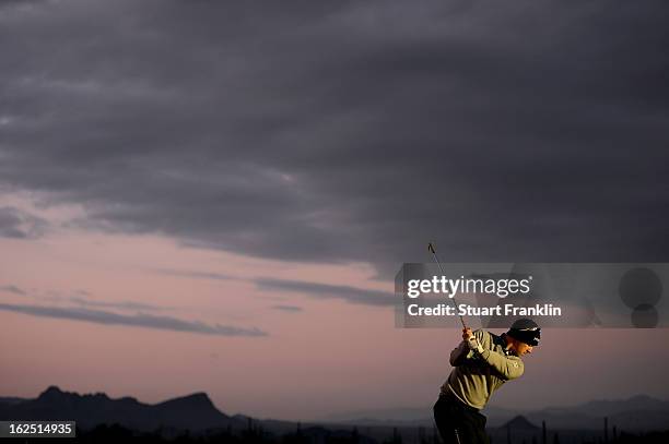 Hunter Mahan hits practice balls on the range prior to his semifinal round match of the World Golf Championships - Accenture Match Play at the Golf...