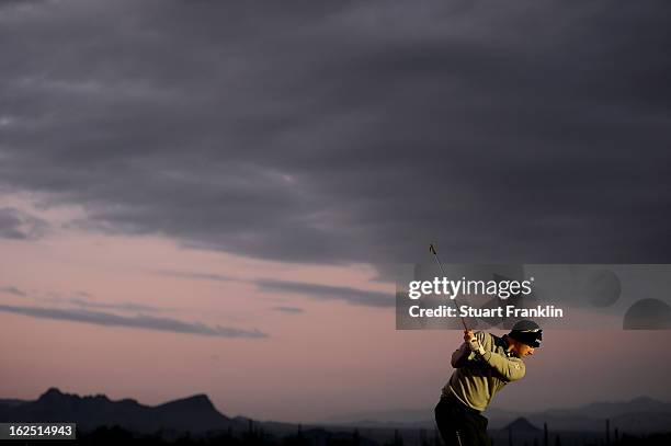 Hunter Mahan hits practice balls on the range prior to his semifinal round match of the World Golf Championships - Accenture Match Play at the Golf...