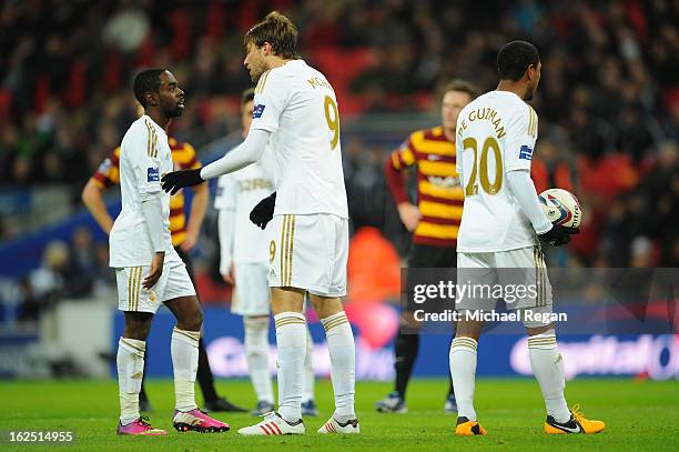 Michu of Swansea City breaks up an arguement between Nathan Dyer of Swansea City and Jonathan de Guzman of Swansea City during the Capital One Cup...