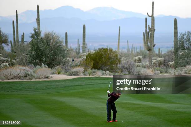 Ian Poulter of England hits his second shot on the second hole during the semifinal round of the World Golf Championships - Accenture Match Play at...