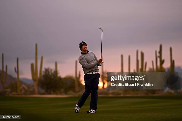Hunter Mahan hits a shot from the fairway on the first hole during the semifinal round of the World Golf Championships - Accenture Match Play at the...