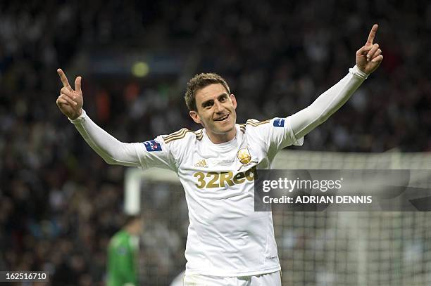 Swansea City's Spanish defender Angel Rangel celebrates after they score their fifth goal during the League Cup final football match between Bradford...