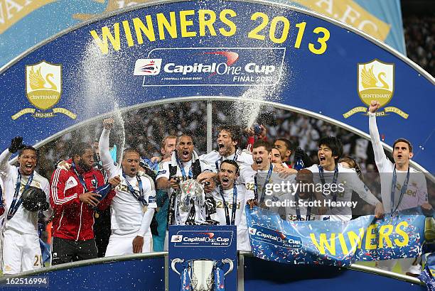 Captain Ashley Williams of Swansea City and team mates celebrate with the trophy during the Capital One Cup Final match between Bradford City and...