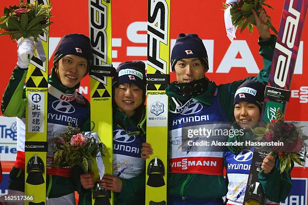 Taku Takeuchi, Yuki Ito, Daiki Ito and Sara Takanashi of Japan celebrate victory in the Mixed Team Ski Jumping HS 106 Final Round at the FIS Nordic...