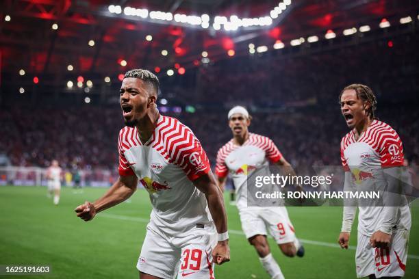 Leipzig's German defender Benjamin Henrichs celebrates scoring the 1-1 goal with Leipzig's Danish forward Yussuf Poulsen and Leipzig's Dutch...