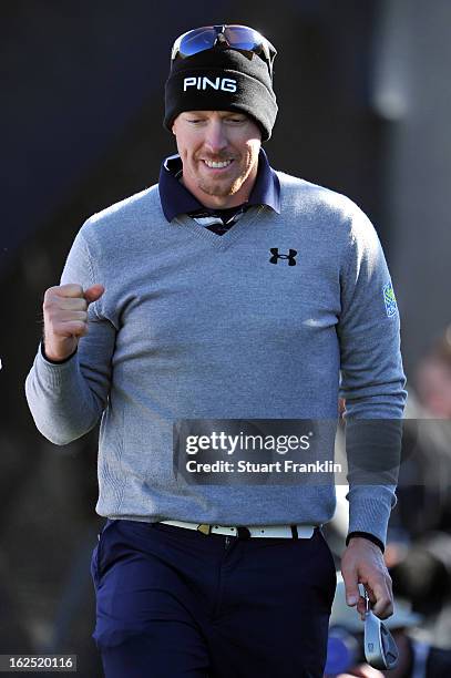 Hunter Mahan reacts after he chipped in for a birdie to win the hole on the 12th hole during the semifinal round of the World Golf Championships -...
