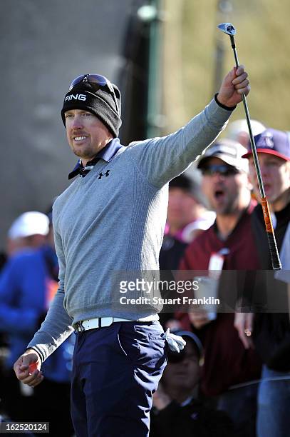 Hunter Mahan reacts after he chipped in for a birdie to win the hole on the 12th hole during the semifinal round of the World Golf Championships -...