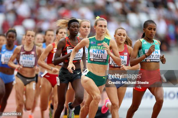 Linden Hall of Team Australia and Birke Haylom of Team Ethiopia compete in Heat 3 of Women's 1500m during day one of the World Athletics...