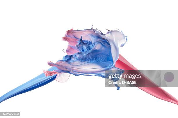 splashing of pink and blue paint - mixing stock pictures, royalty-free photos & images