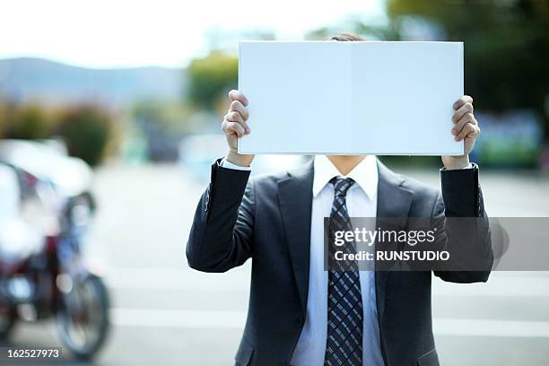 business in green - obscured face ストックフォトと画像